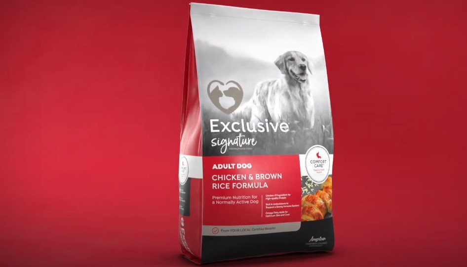 A red bag of Exclusive Signature Adult Dog Chicken & Brown Rice Formula